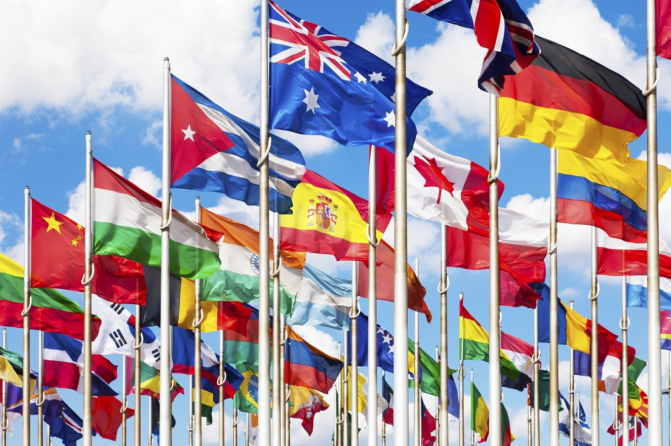 Numerous flags of countries flying in the wind